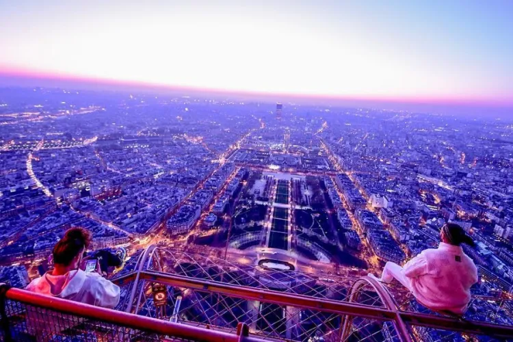 The group contemplating Paris from the Eiffel Tower